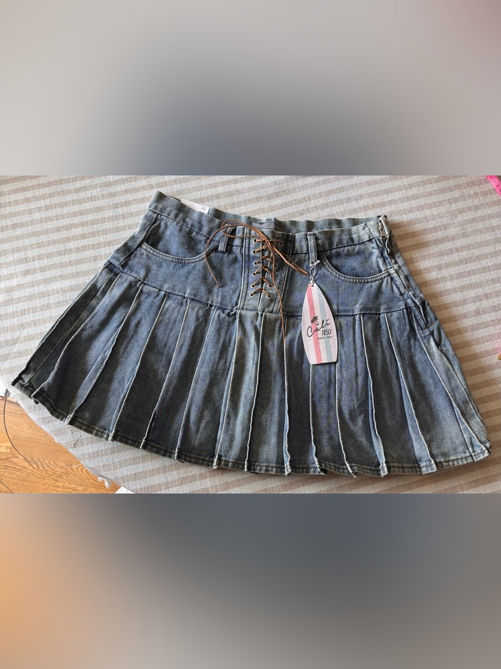 Washed mid Denim Pleated Skater Skirt with Lace-Up Front